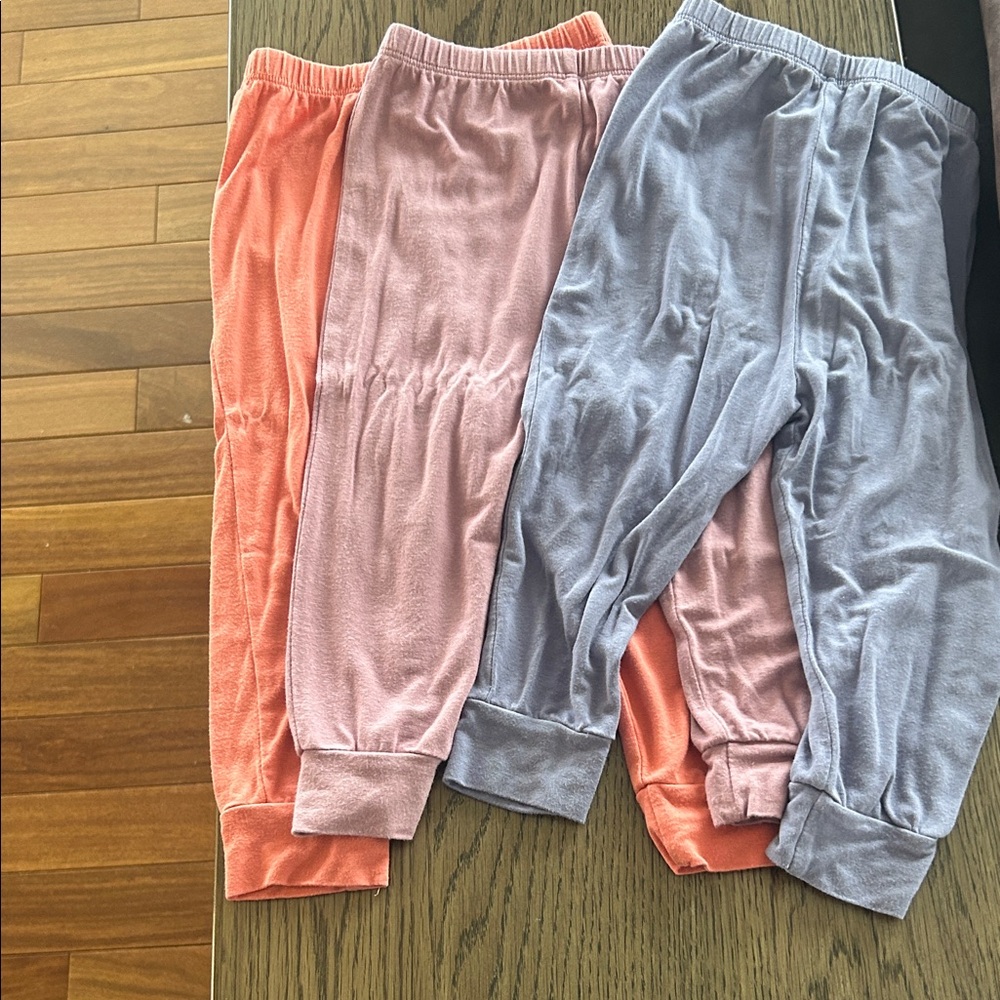 Set of Three Kyte BABY Pants in Coral, Mauve, and Purple